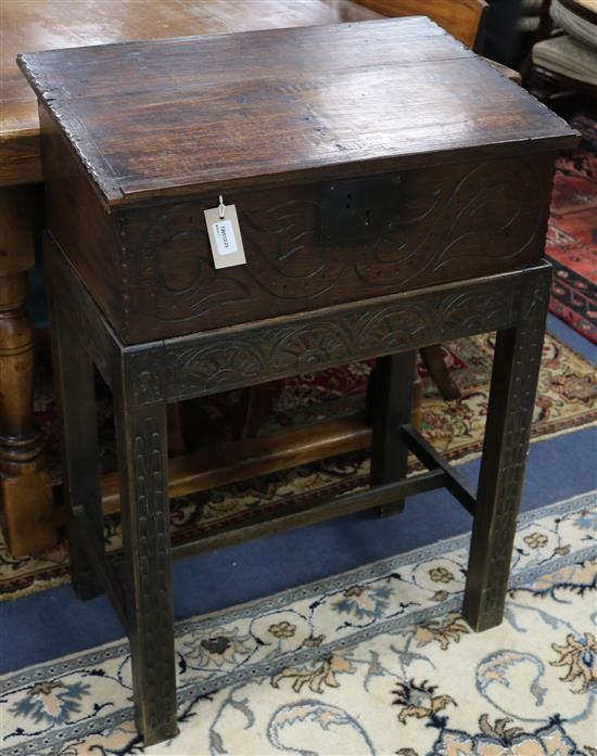 A carved oak bible box on stand W: 64cm